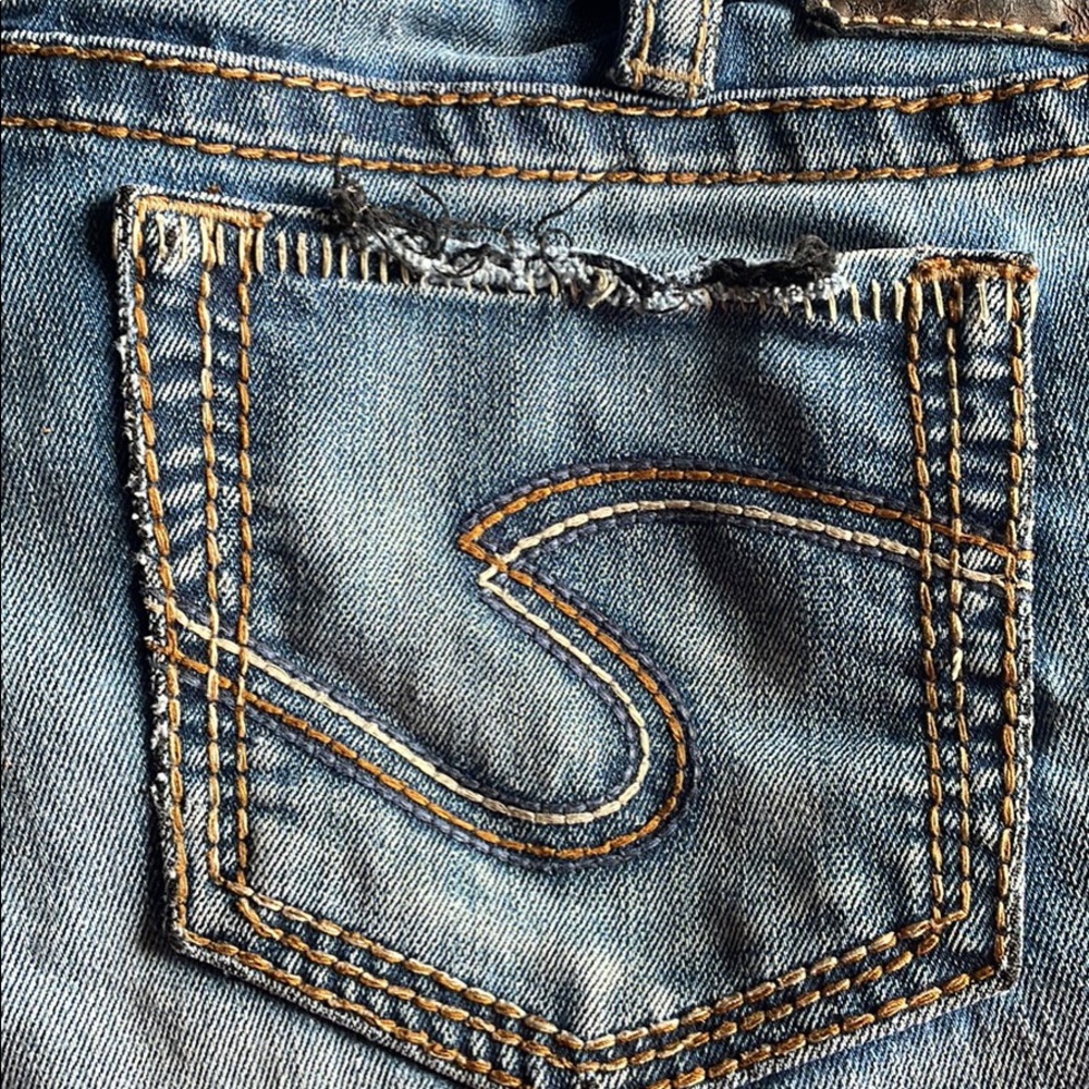 Used silver jeans. They are distressed on the bottom of the legs